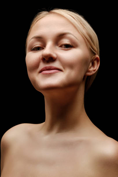 istock topless woman on black 1366947319