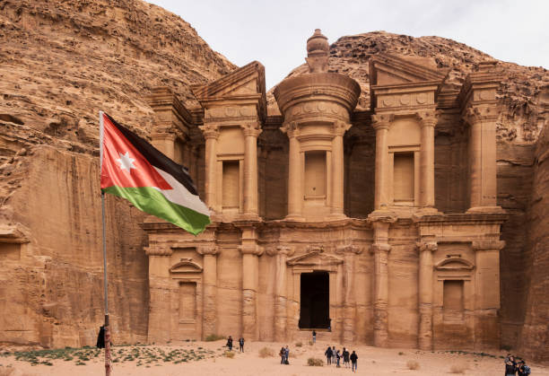 istock Ad Deir (the monastery) with jordanian flag. Petra, Jordan 1366947437