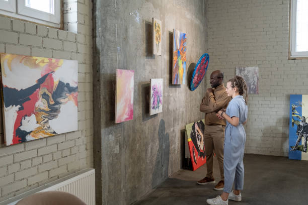 istock Young couple visiting art exhibition 1366948716