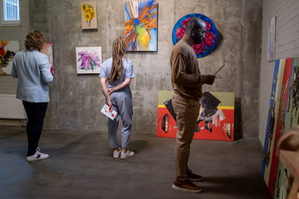 istock Group of people visiting the art gallery 1366948746