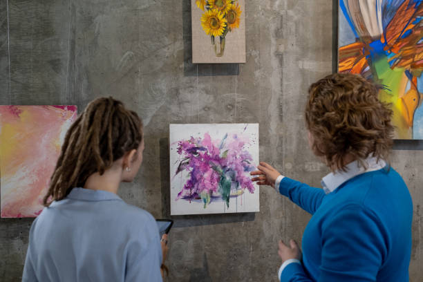 istock Woman with guide at art gallery 1366948749
