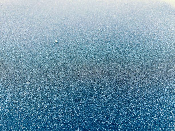 Frost on the glass. Beautiful frosty patterns. Winter background. Ice texture.