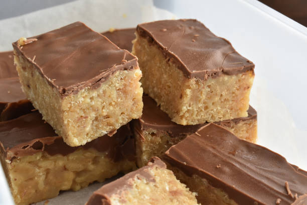istock Chocolate caramel rice crispy treats in a plastic box. 1366954161