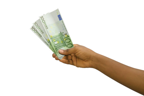 istock Fair hand holding 3D rendered Euro notes isolated on white background 1366954382