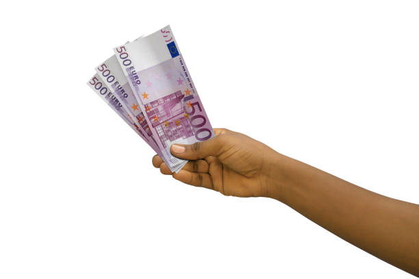 istock Fair hand holding 3D rendered 500 Euro notes isolated on white background 1366954446