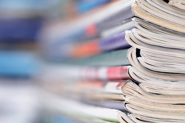 istock Stack of magazines that progressively blurs toward the left 1366956117
