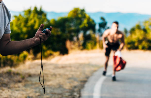 istock Young fit men in doing jogging training, measuring time on smartwatch 1366958071