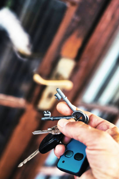 Holding a key to success isolated on blue background
