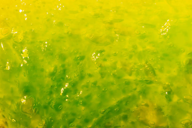 Background of green transparent slime with air bubbles stock photo