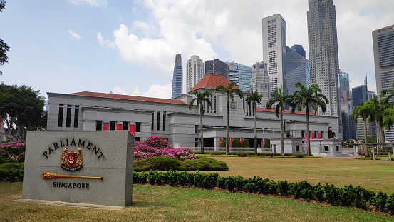 Singapore- 11 Aug, 2019: Parliament of Singapore and marble plate with city skyline in background
