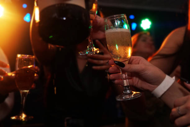 istock Partial view of happy young friends drinking champagne 1366962711