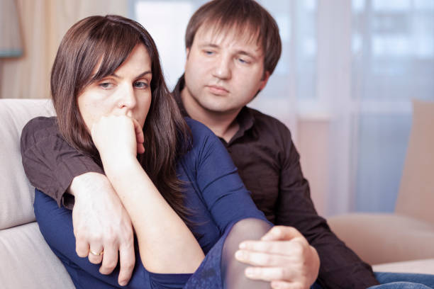 istock Family Issues. Caucasian Couple Sitting With Sad Emotions Embraced. 1366964082