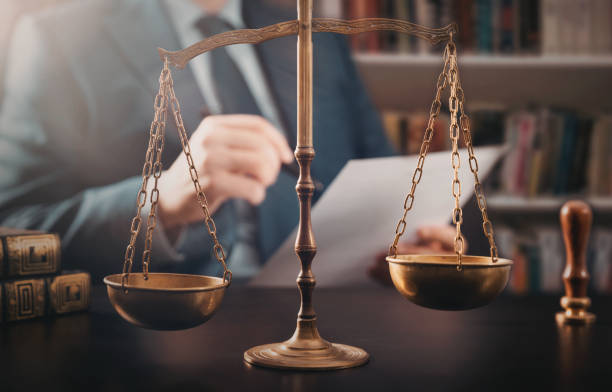 istock Lawyer working in the office. Law and justice. 1366965574