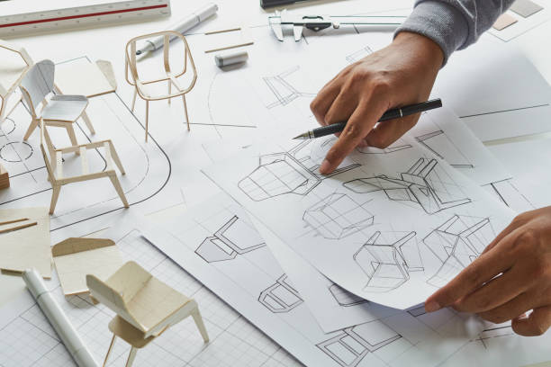 istock Designer sketching drawing design development product plan draft chair armchair Wingback Interior furniture prototype manufacturing production. designer studio concept . 1366966159
