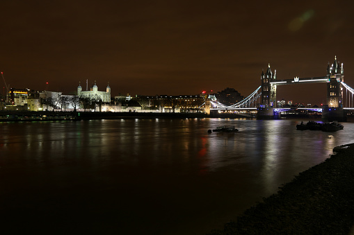 The illuminated sights of Old London with their reflection in the River Thames