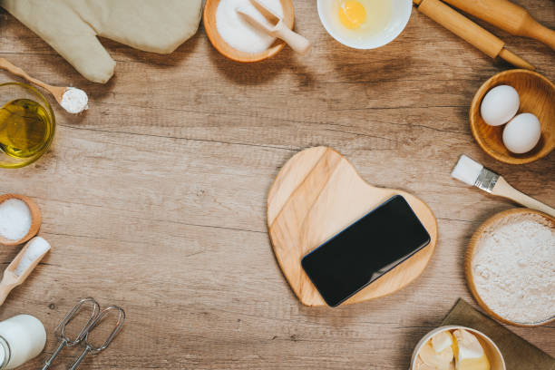 istock Heart shape wooden board near ingridients for prepairing dough 1366967797