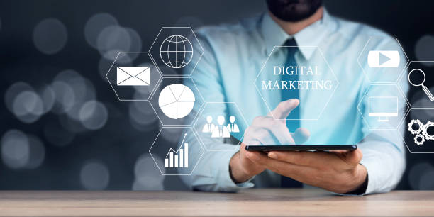 istock Digital marketing with man holding a tablet computer 1366967886