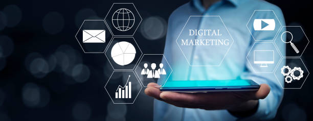 istock Digital marketing with man holding a tablet computer 1366967894
