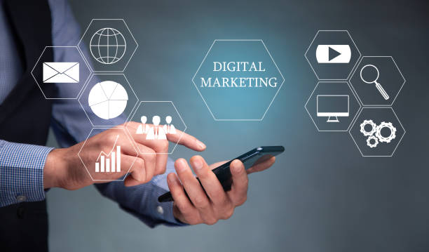 istock Man hand holding smart phone digital marketing word 1366967899
