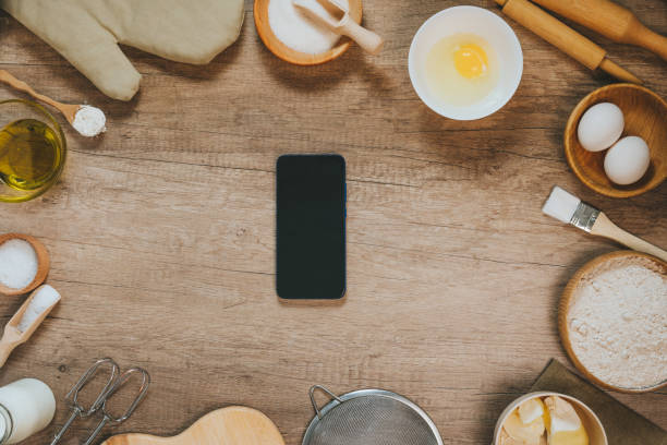 istock Smartphone with epmty screen near ingridients for prepairing dough 1366967989