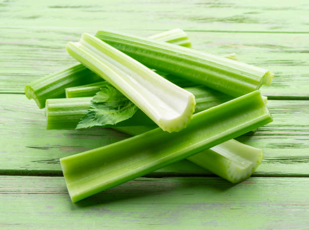 istock Pile of celery ribs isolated on white background. 1366969123