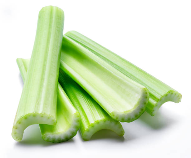 istock Pile of celery ribs isolated on white background. 1366969252