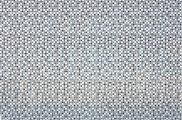 Grey perforated panels for facing the facade of the building. For background or texture.