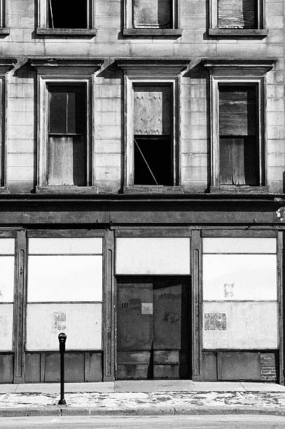 istock Abandoned Ghetto Builidng, Boarded Store Front, Black and White 136697107