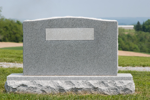 Cemetery headstone in summer with no name, close up, balnk and ready to add your own text to the nameplate as a design element.