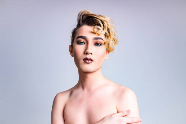 body positive i love myself man with gorgeous make up and hairstyle in studio white background body positive i love myself man with gorgeous make up and hairstyle in studio white background. gender stereotypes photos stock pictures, royalty-free photos & images