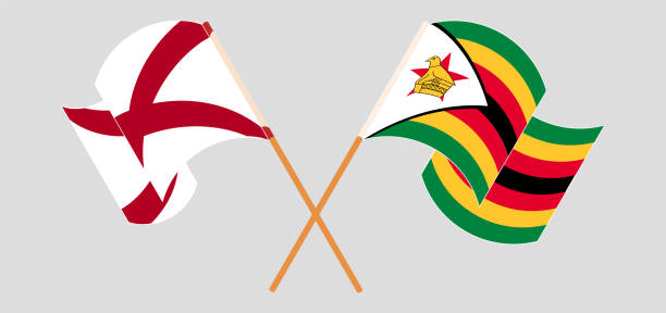 Crossed and waving flags of The State of Alabama and Zimbabwe Crossed and waving flags of The State of Alabama and Zimbabwe. Vector illustration alabama football stock illustrations