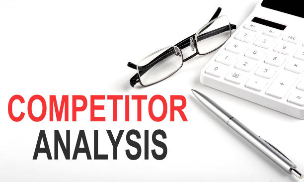 istock COMPETITOR ANALYSIS Concept. Calculator,pen and glasses on the white background 1366974025