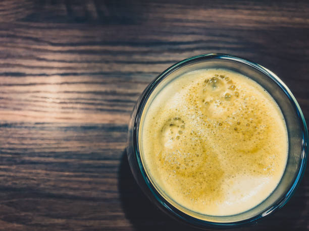 istock Coffee in a glass on a wooden table. 1366974060