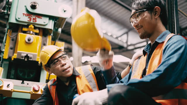 Depressed man and Encourage from colleagues working in factory. Positive emotions concept.