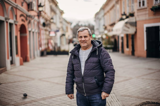 istock A lonely man on a city street 1366976243