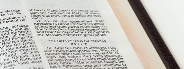 istock Jesus Christ's birth passage in open Holy Bible Book 1366976262