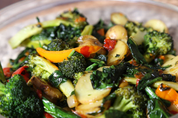 istock Vegetable side dish of potato, spinach, bell pepper and onions 1366977488