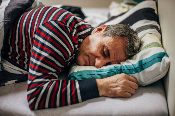 istock The old man is sleeping in bed 1366978109