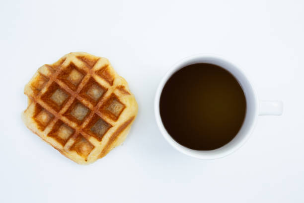 istock Top view of Coffee cup and waffle on white background 1366978113