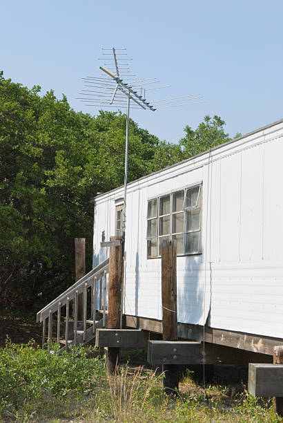 istock Mobile Home House Trailer with TV Antenna, Rough Condition 136697813