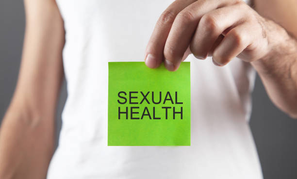 istock Man showing Sexual Health text in sticky note. 1366978837