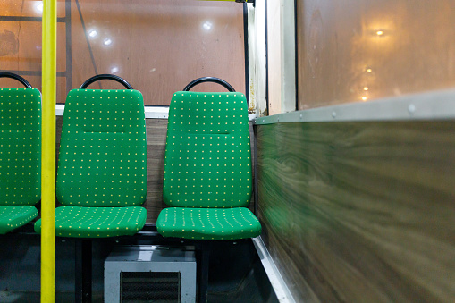 Trolleybus seats. Interior of public transport at night