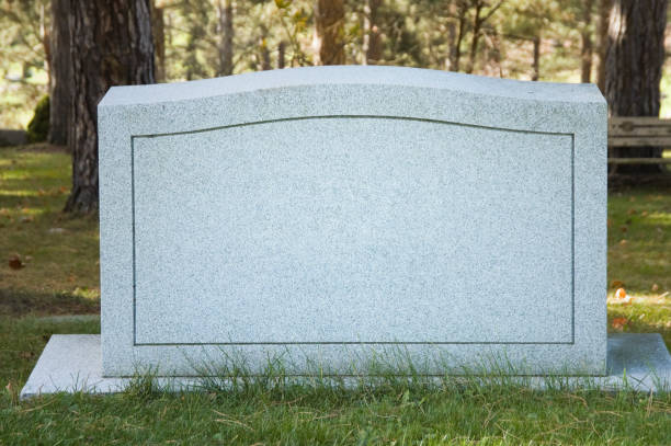 Blank Cemetery Headstone Close Up, No Name Blank granite headstone in a cemetery ready for your text, close up with no name, selective focus. tombstone stock pictures, royalty-free photos & images