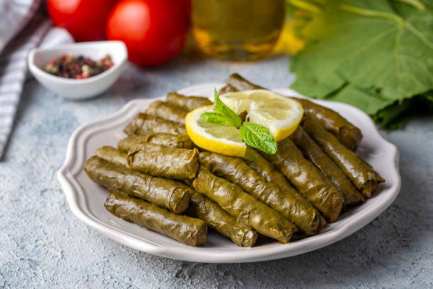 traditional delicious turkish foods; stuffed leaves (yaprak sarmasi) - dolmades imagens e fotografias de stock