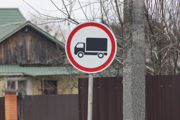 istock one round road sign prohibiting trucks on a pole 1366988591