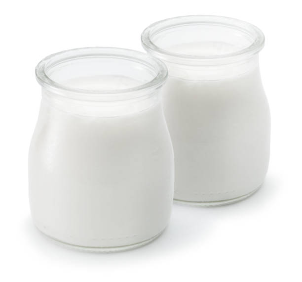 istock Two glass containers with plain yoghurt isolated on white background. 1366988933