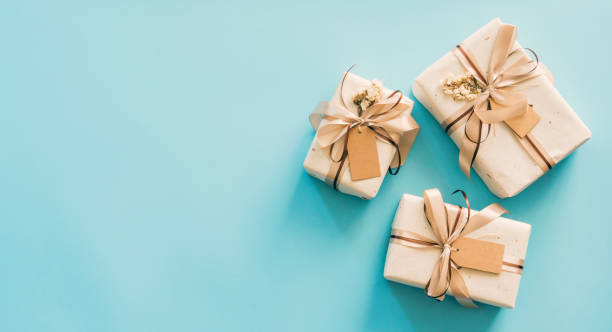 istock Craft paper gift boxs set on blue background with copy space for text. 1366988990