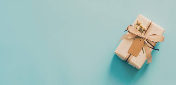 istock Craft paper gift box set on blue background with copy space for text. 1366989125