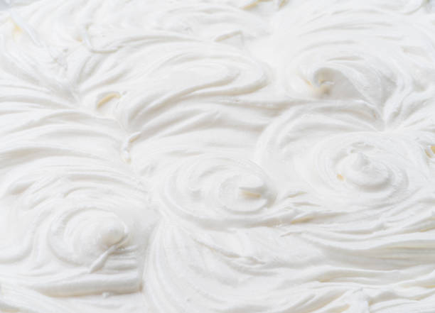 istock Creamy waves and swirls in yoghurt or cream surface. Top view. 1366989162