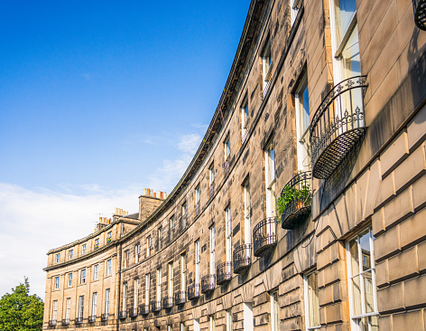Sunny summer weather at a curving street in Edinburgh's New Town and Stockbridge areas.